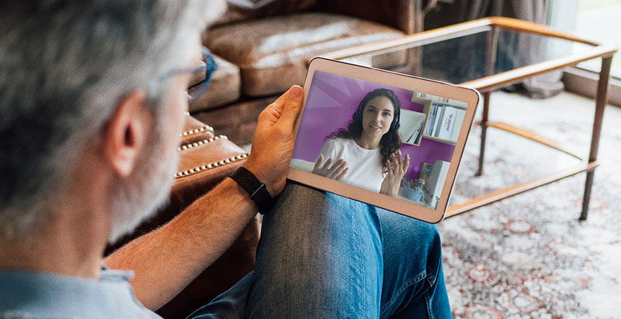 Image of LEQVIO® Care Specialist video
chatting with patient.